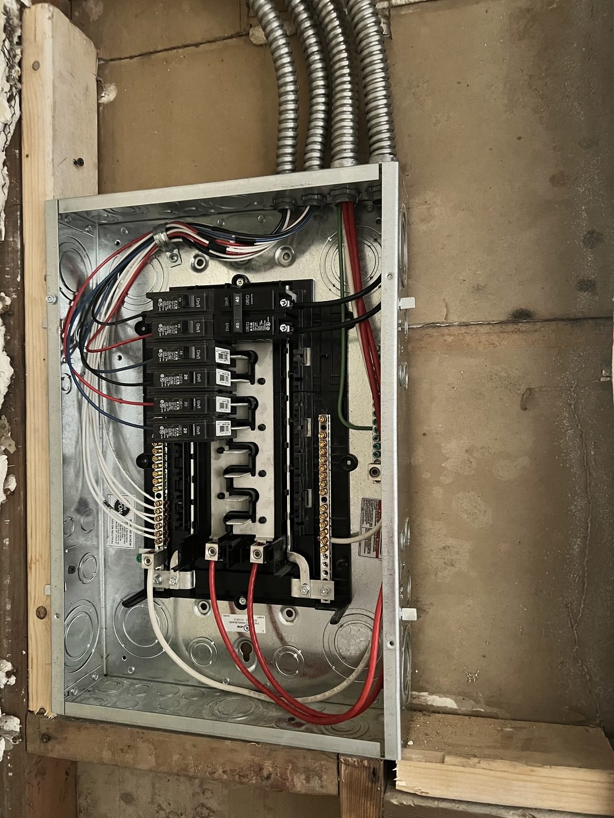 New breaker panel after: clean runs, labeled circuits, same wall