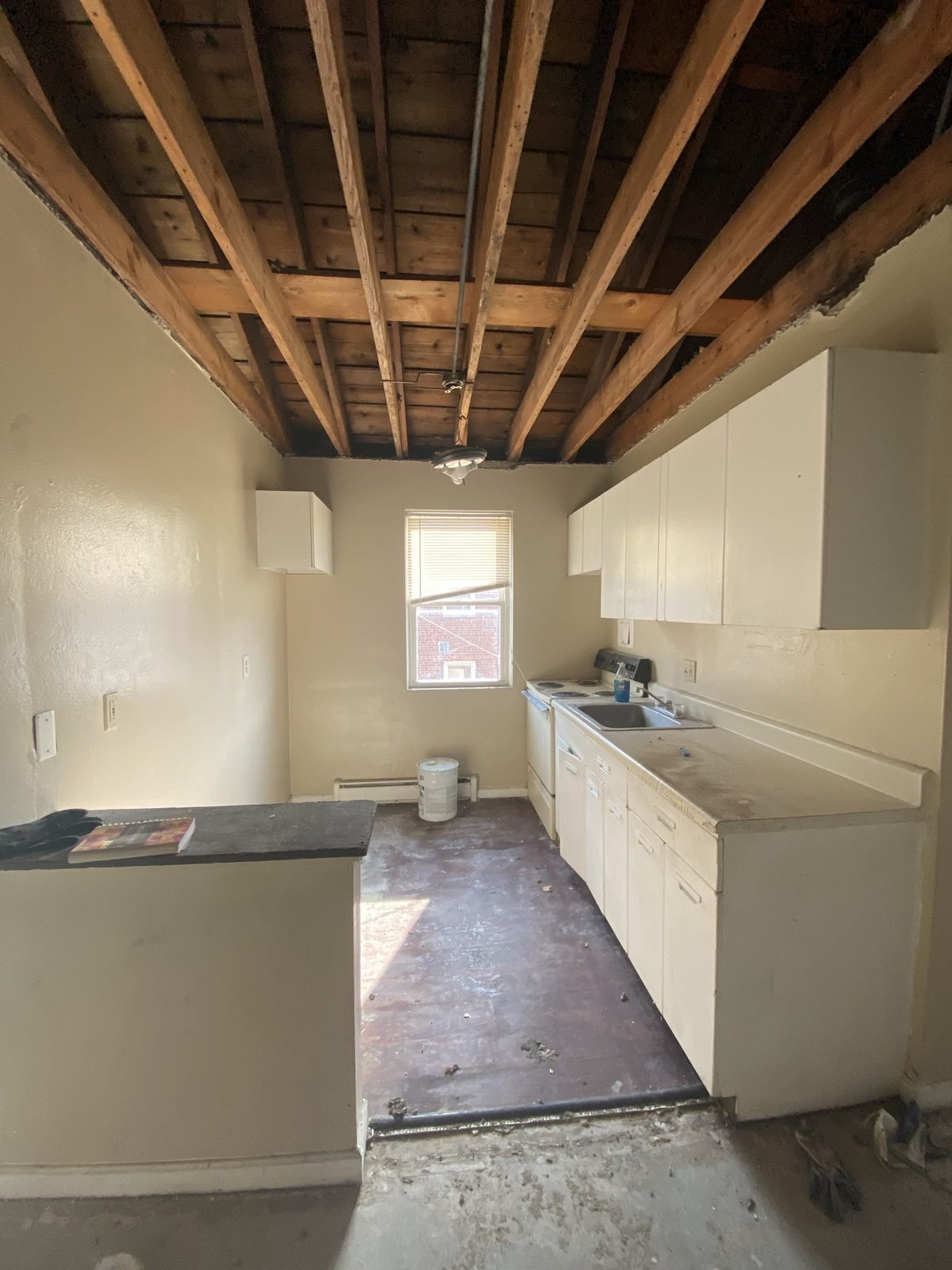 Kitchen before: ceiling removed down to the joists