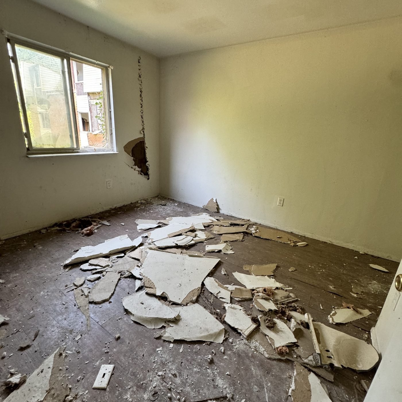 Bedroom before: ceiling collapsed onto the floor